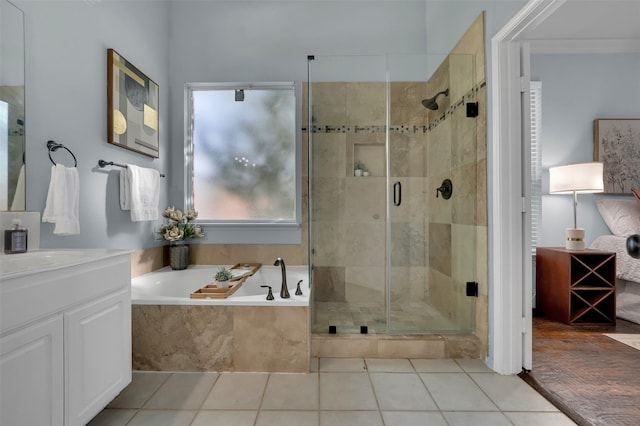 1102 Mccormick St, Garland, TX 75040 - full bathroom featuring a stall shower, a bath, tile patterned floors, and vanity