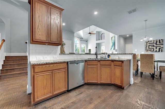1102 Mccormick St, Garland, TX 75040 - kitchen featuring dishwasher, a sink, tasteful backsplash, ceiling fan, and light stone counters