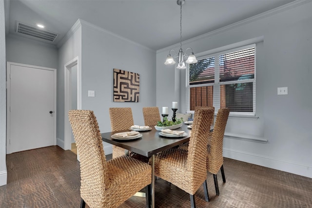 1102 Mccormick St, Garland, TX 75040 - dining area featuring a chandelier, ornamental molding, baseboards, and wood finished floors
