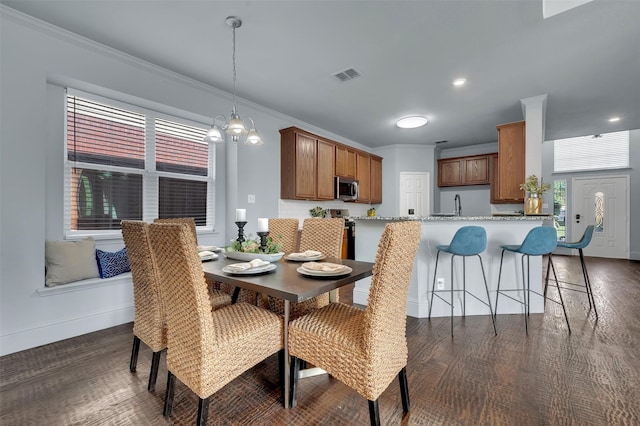 1102 Mccormick St, Garland, TX 75040 - dining space with ornamental molding, baseboards, dark wood-style flooring, plenty of natural light, and recessed lighting