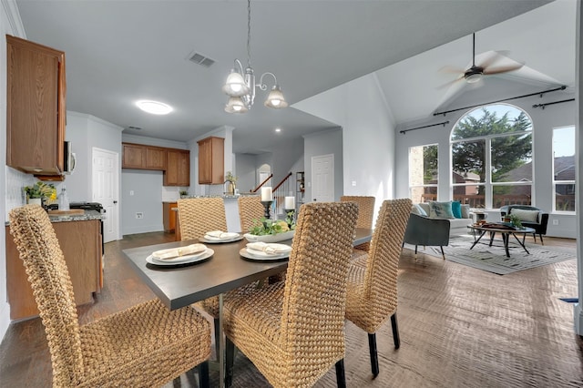 1102 Mccormick St, Garland, TX 75040 - dining space featuring ceiling fan, vaulted ceiling, a chandelier, crown molding, and baseboards