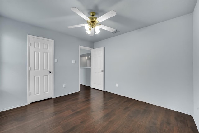 1102 Mccormick St, Garland, TX 75040 - unfurnished bedroom featuring wood finished floors, baseboards, and ceiling fan