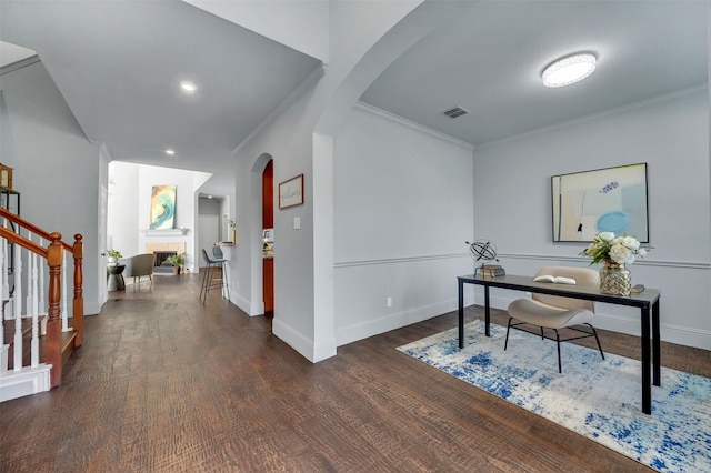 1102 Mccormick St, Garland, TX 75040 - office with arched walkways, ornamental molding, dark wood finished floors, baseboards, and recessed lighting
