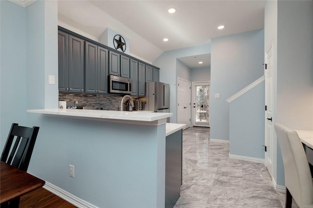 5798 Antique Rose Trl, Fairview, TX 75069 - kitchen with stainless steel appliances, decorative backsplash, light countertops, recessed lighting, and a peninsula