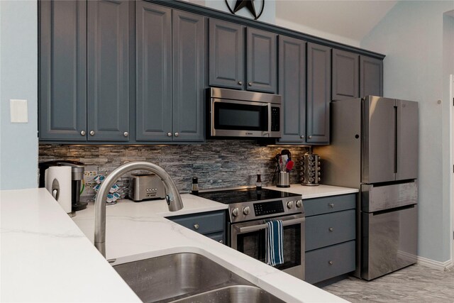 5798 Antique Rose Trl, Fairview, TX 75069 - kitchen featuring appliances with stainless steel finishes, a sink, tasteful backsplash, light stone counters, and baseboards