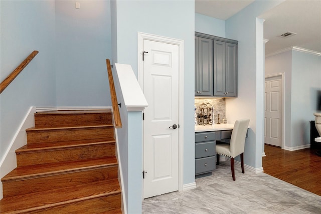 5798 Antique Rose Trl, Fairview, TX 75069 - staircase featuring built in desk, ornamental molding, and baseboards