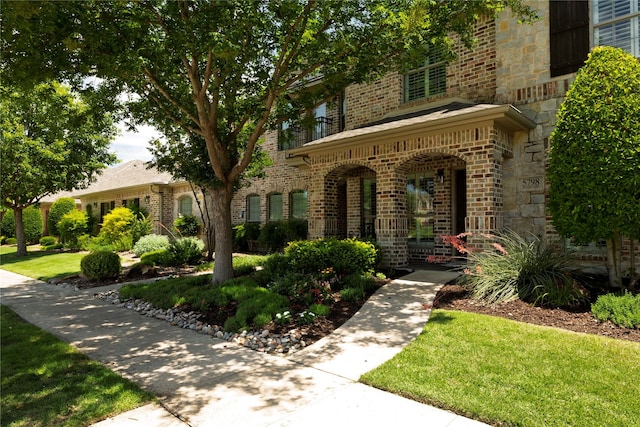 5798 Antique Rose Trl, Fairview, TX 75069 - view of front facade with brick siding and a front lawn