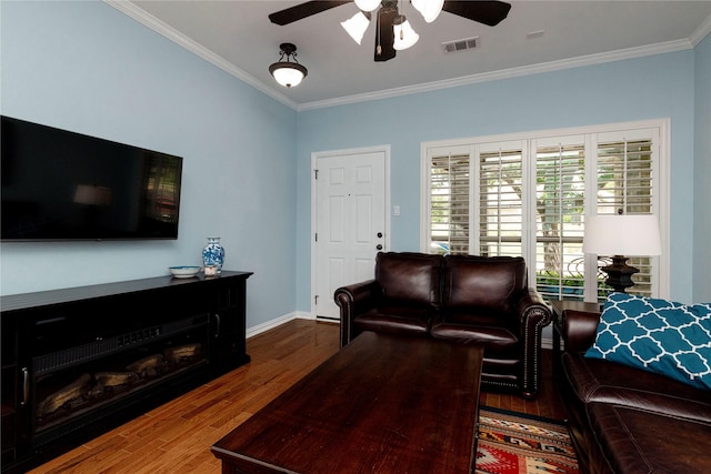 5798 Antique Rose Trl, Fairview, TX 75069 - living room with ornamental molding, a ceiling fan, wood finished floors, and baseboards