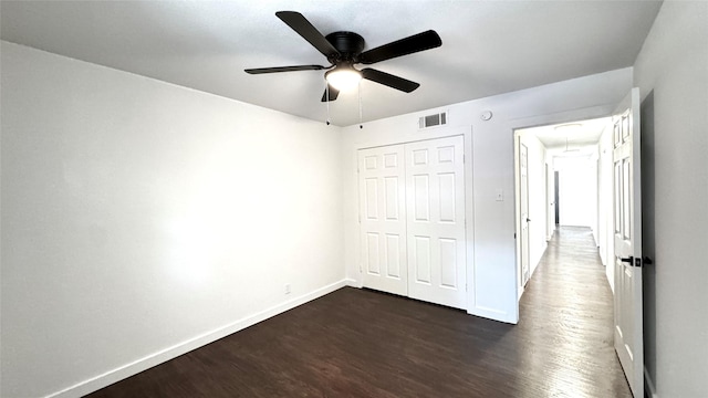 3315 Cedarcroft Ln, Dallas, TX 75233 - unfurnished bedroom with attic access, dark wood finished floors, a closet, baseboards, and a ceiling fan