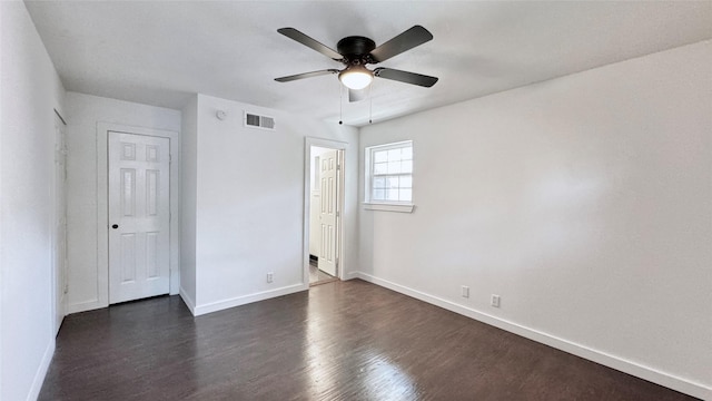 3315 Cedarcroft Ln, Dallas, TX 75233 - unfurnished bedroom featuring baseboards, dark wood finished floors, and a ceiling fan