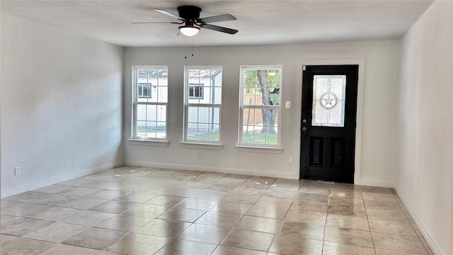 3315 Cedarcroft Ln, Dallas, TX 75233 - foyer entrance featuring ceiling fan, baseboards, and light tile patterned floors