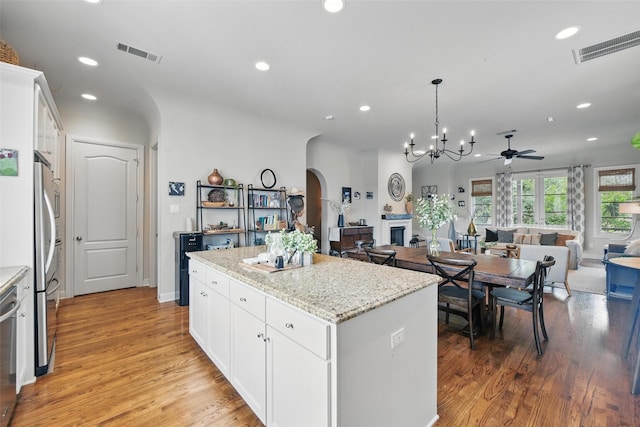 261 Casa Blanca Ave, Fort Worth, TX 76107 - kitchen with arched walkways, a ceiling fan, open floor plan, a kitchen island, and recessed lighting
