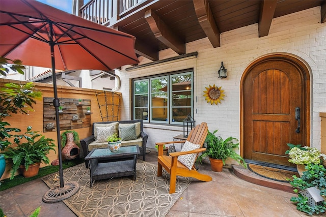 261 Casa Blanca Ave, Fort Worth, TX 76107 - entrance to property featuring brick siding, a balcony, outdoor lounge area, and a patio