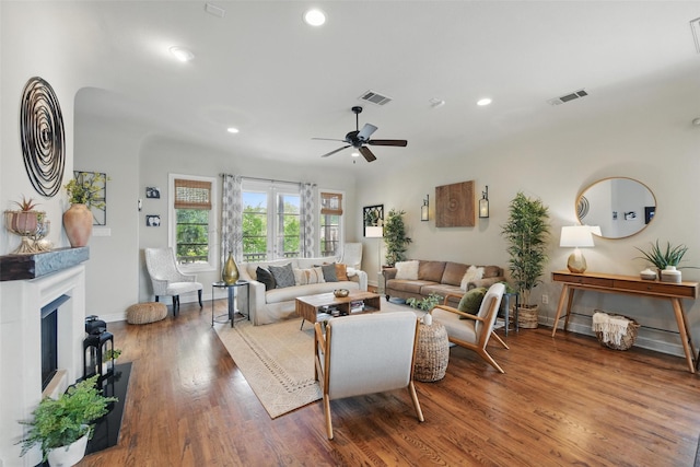 261 Casa Blanca Ave, Fort Worth, TX 76107 - living room featuring a fireplace with raised hearth, baseboards, recessed lighting, wood finished floors, and a ceiling fan