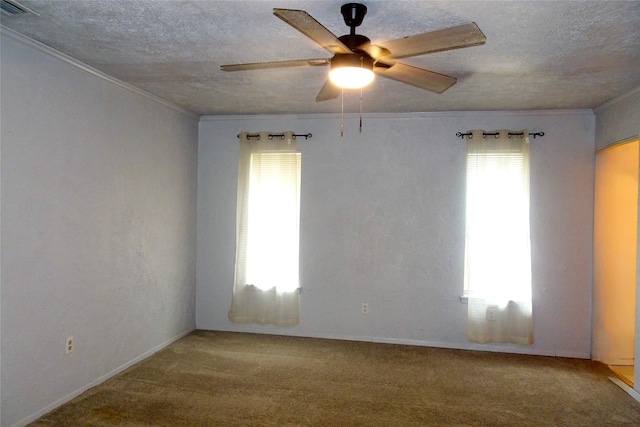 212 E Kearney St, Mesquite, TX 75149 - carpeted empty room with healthy amount of natural light, crown molding, ceiling fan, and a textured ceiling