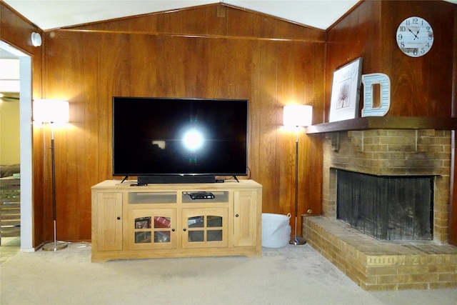 212 E Kearney St, Mesquite, TX 75149 - unfurnished living room with vaulted ceiling, wooden walls, carpet, and a fireplace