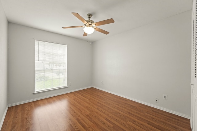 3231 Rockne Ln, Mesquite, TX 75150 - empty room featuring a ceiling fan, wood finished floors, and baseboards