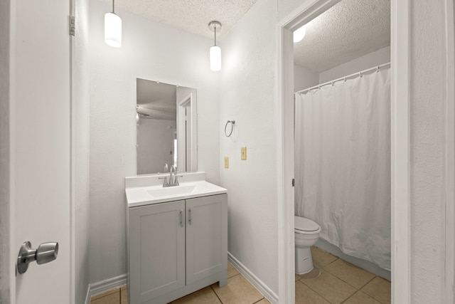 3231 Rockne Ln, Mesquite, TX 75150 - full bathroom with a textured ceiling, vanity, toilet, tile patterned flooring, and a shower with shower curtain