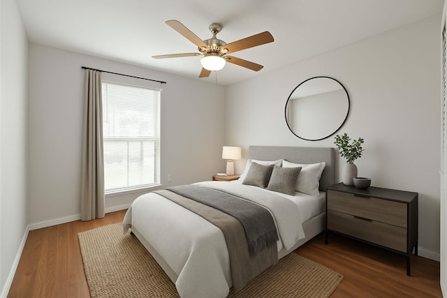3231 Rockne Ln, Mesquite, TX 75150 - bedroom with dark wood finished floors, baseboards, and a ceiling fan