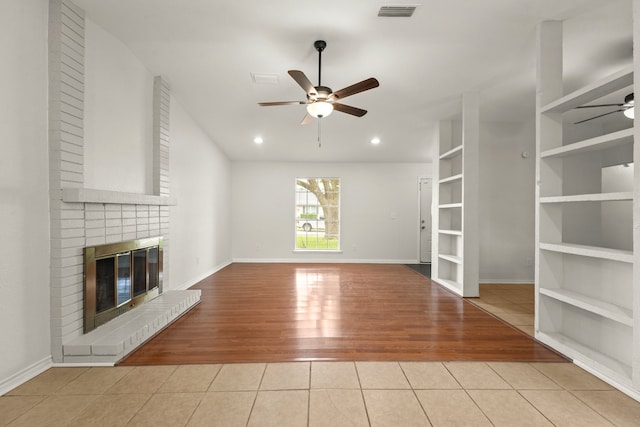 3231 Rockne Ln, Mesquite, TX 75150 - unfurnished living room with ceiling fan, wood finished floors, a fireplace, baseboards, and recessed lighting