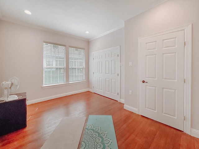 1530 W 5th Ave, Corsicana, TX 75110 - unfurnished bedroom with light wood-type flooring, ornamental molding, baseboards, recessed lighting, and a closet