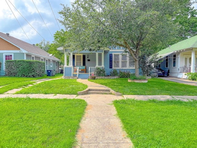 1530 W 5th Ave, Corsicana, TX 75110 - view of front of house featuring covered porch and a front lawn