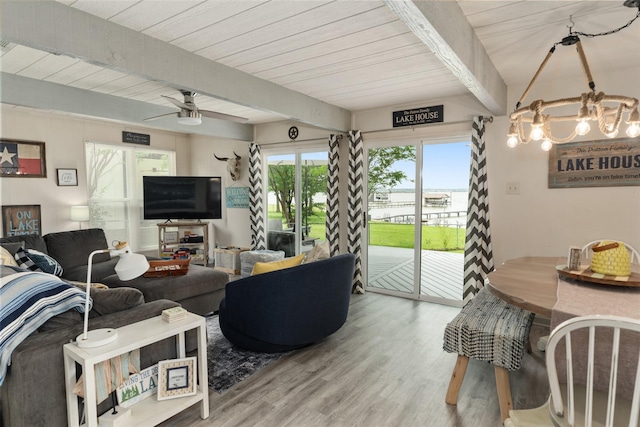 166 Ocean Dr, Gun Barrel City, TX 75156 - living room featuring wood finished floors, a chandelier, ceiling fan, and wooden ceiling with exposed beams