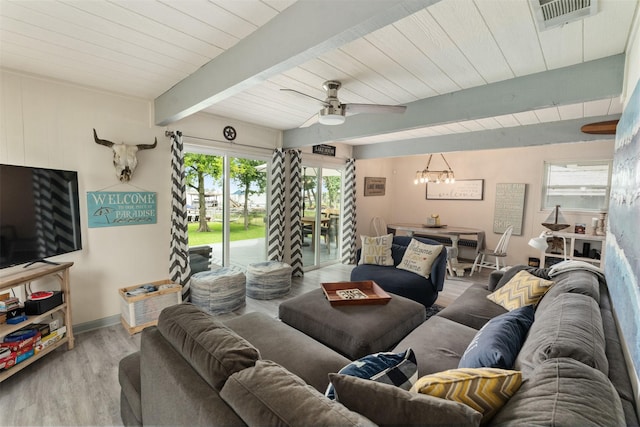 166 Ocean Dr, Gun Barrel City, TX 75156 - living room with wood finished floors, a ceiling fan, beamed ceiling, a chandelier, and baseboards