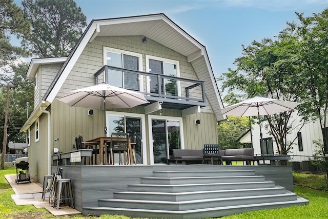 166 Ocean Dr, Gun Barrel City, TX 75156 - rear view of property featuring a balcony, a gambrel roof, and a deck