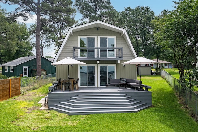 166 Ocean Dr, Gun Barrel City, TX 75156 - rear view of house featuring a balcony, a gambrel roof, a wooden deck, and board and batten siding