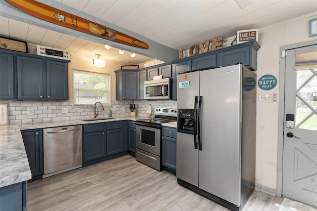 166 Ocean Dr, Gun Barrel City, TX 75156 - kitchen with appliances with stainless steel finishes, decorative backsplash, light wood-type flooring, light stone counters, and a wooden ceiling with exposed beams