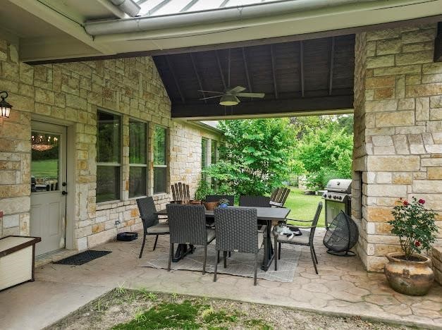 121 Big Jake Ct, Weatherford, TX 76088 - view of patio with ceiling fan, outdoor dining space, and a grill