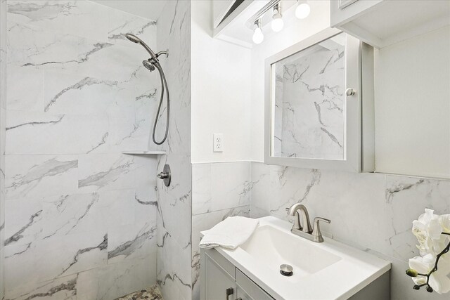 1401 S Stratton St, Decatur, TX 76234 - bathroom with a marble finish shower, vanity, tile walls, and wainscoting
