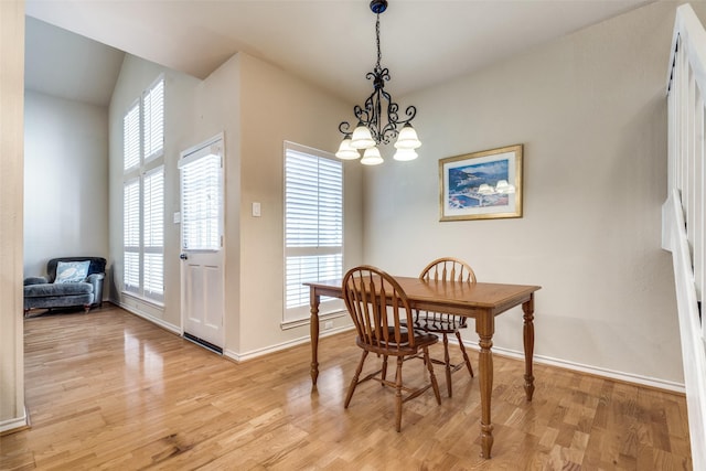 6220 Bentwood Trl Unit 907, Dallas, TX 75252 - dining area with a chandelier, light wood-style flooring, and baseboards