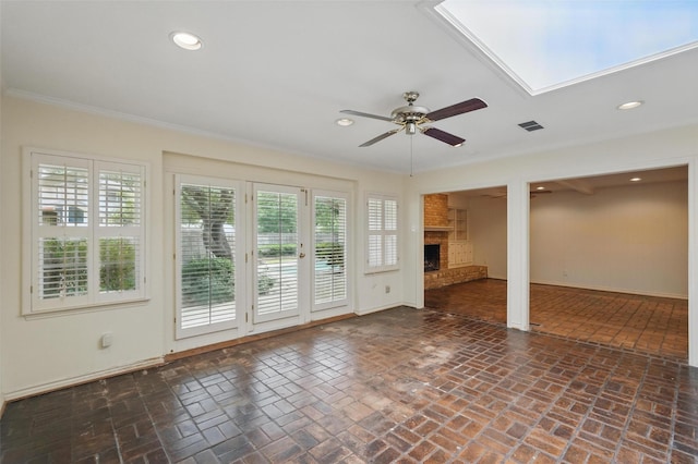 6 Shenandoah Pl, Richardson, TX 75080 - unfurnished living room featuring brick flooring, a ceiling fan, a brick fireplace, baseboards, and recessed lighting