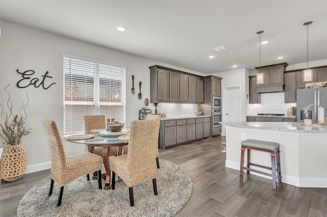 4444 Blue Mist Dr, Fort Worth, TX 76036 - dining area featuring dark wood-style flooring, recessed lighting, and baseboards