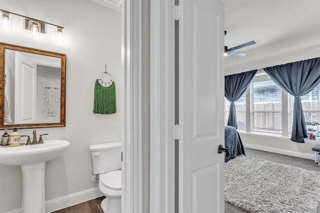 4444 Blue Mist Dr, Fort Worth, TX 76036 - bathroom featuring baseboards, toilet, a ceiling fan, and a sink