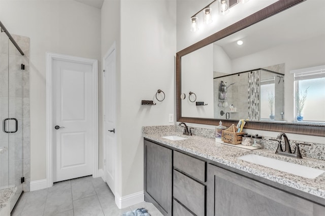 4444 Blue Mist Dr, Fort Worth, TX 76036 - bathroom featuring a stall shower, tile patterned floors, double vanity, and baseboards