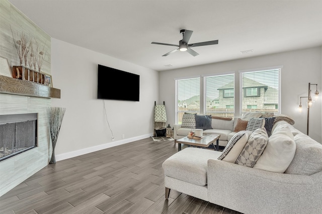 4444 Blue Mist Dr, Fort Worth, TX 76036 - living area featuring ceiling fan, baseboards, wood finished floors, and a tiled fireplace