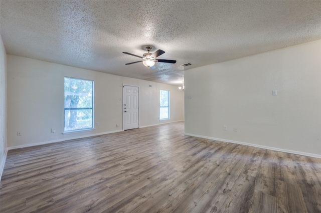 110 Muleta Dr, Oak Point, TX 75068 - unfurnished room featuring a textured ceiling, wood finished floors, a ceiling fan, and baseboards