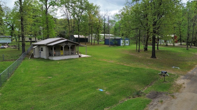 150 David St, Jefferson, TX 75657 - view of yard featuring a porch and an outbuilding
