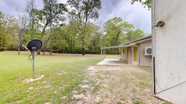 150 David St, Jefferson, TX 75657 - view of green lawn with a cooling unit and a patio area