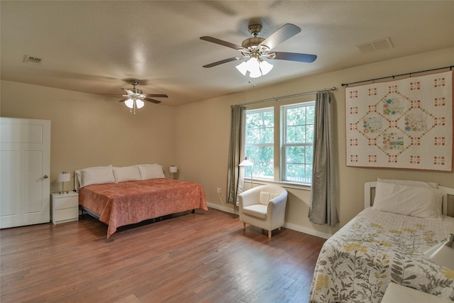 6495 Smoky Hill Ct, Granbury, TX 76049 - bedroom with wood finished floors, baseboards, and ceiling fan