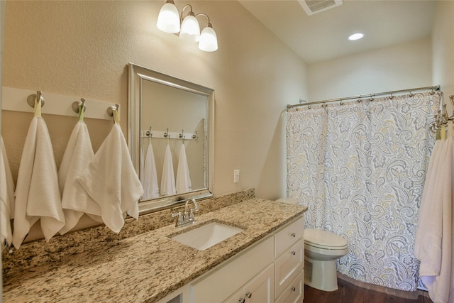 6495 Smoky Hill Ct, Granbury, TX 76049 - bathroom featuring toilet, vanity, wood finished floors, and curtained shower