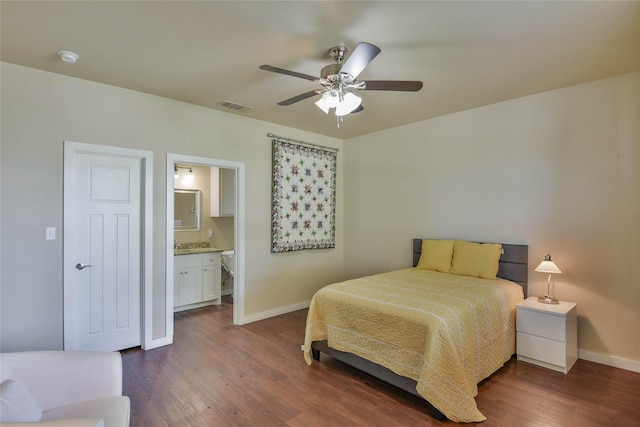 6495 Smoky Hill Ct, Granbury, TX 76049 - bedroom with baseboards, dark wood-style floors, a ceiling fan, and connected bathroom