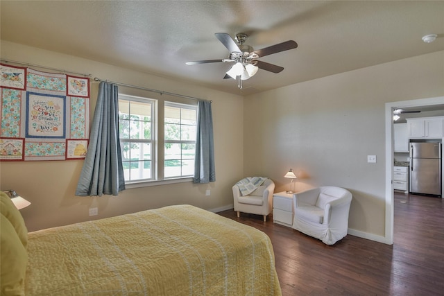 6495 Smoky Hill Ct, Granbury, TX 76049 - bedroom featuring freestanding refrigerator, dark wood-style floors, baseboards, and ceiling fan
