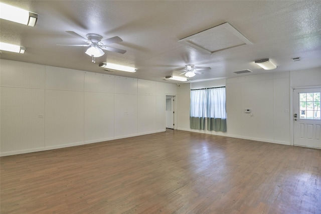 6495 Smoky Hill Ct, Granbury, TX 76049 - unfurnished room with wood finished floors, ceiling fan, attic access, and baseboards