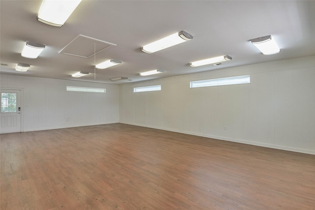 6495 Smoky Hill Ct, Granbury, TX 76049 - empty room featuring attic access, wood finished floors, and baseboards