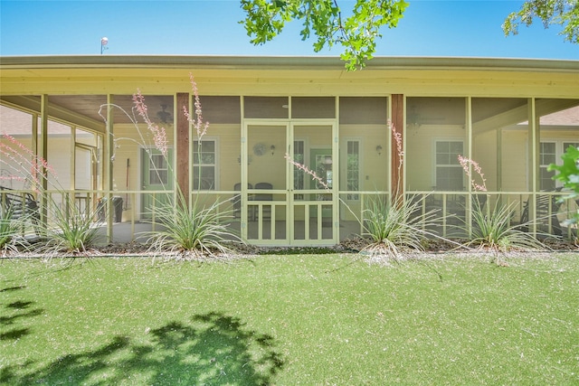 6495 Smoky Hill Ct, Granbury, TX 76049 - back of house featuring a lawn and a sunroom