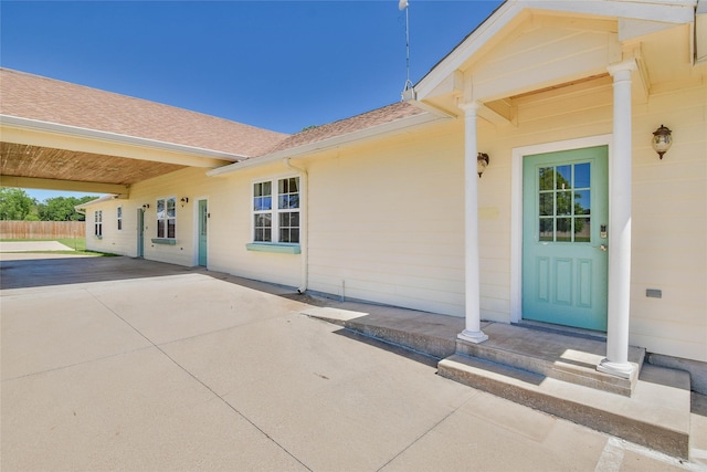 6495 Smoky Hill Ct, Granbury, TX 76049 - view of exterior entry featuring a patio and roof with shingles